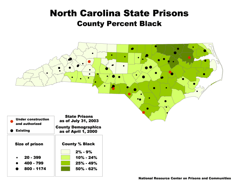 A map of North Carolina, with its current and proposed prisons marked by dots. The size of the dot is based on the size of the prison. Each county is colored based on what percent of its population is black.